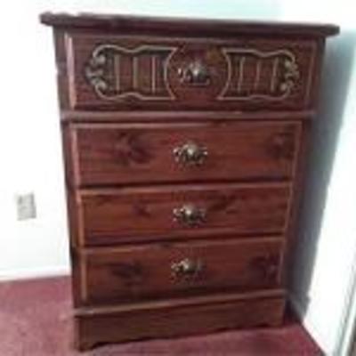 Dresser with Ornate Top Drawer

