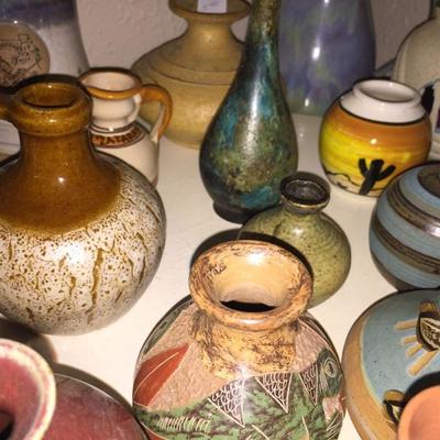Large collection of small pottery vases 