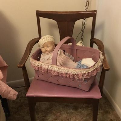 Antique doll, mid century chair