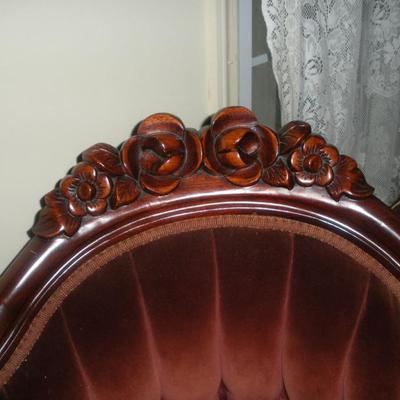 carved back of love seat