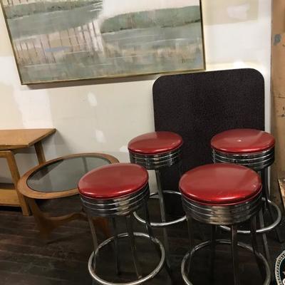 50s / 60s style black Formica  table with boomerang pattern and red sparkly stools