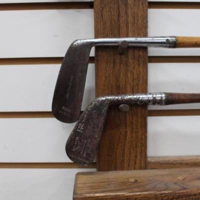 Golf clubs with oak rack