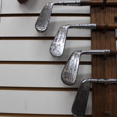 Golf clubs with oak rack