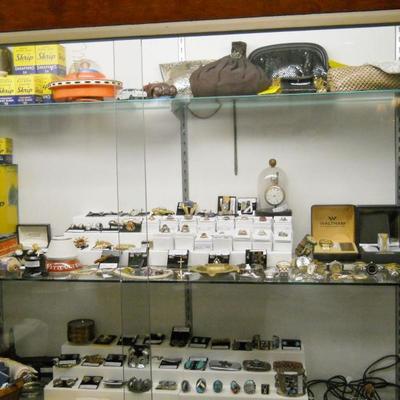 Vintage battery operated space ship, vintage cars, bottles of ink and ink wells, fountain pens,  purses, jewelry etc.