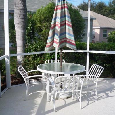 Patio table with 4 chairs and umbrella