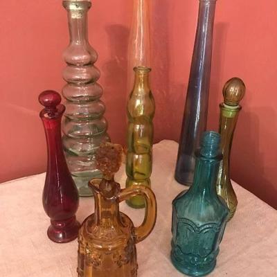 Assorted colored unique shaped bottles (some with