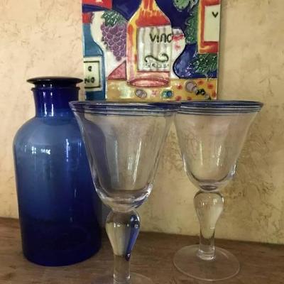 Blue Glass Decanter, wine glasses and ceramic wall