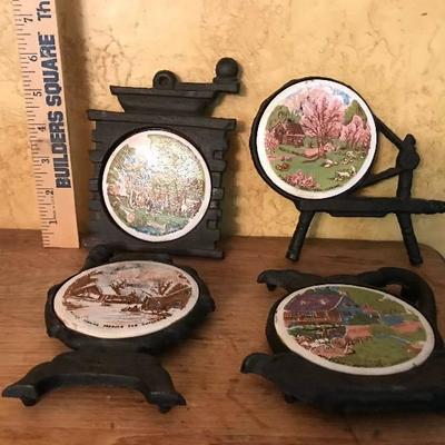 Ceramic and Cast Iron Trivets--with country scenes