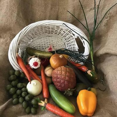 Basket full of a variety of artificial vegetables