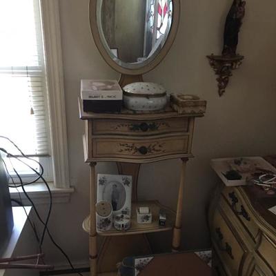 Lady's tall makeup mirror stand with drawers