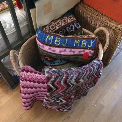 Woven Afghan blankets and pillow.