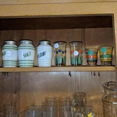 Vintage milk glass shakers and juice cups.