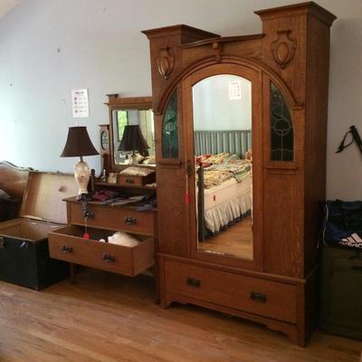 Original arts and crafts wardrobe with stained glass decorations.