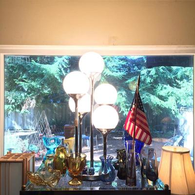 1970s retro lamp surrounded by art glass.