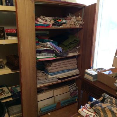 Large cupboard filled with vntage sewing material
