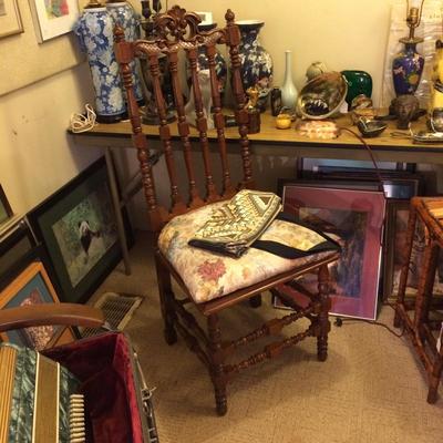 Decorative high-backed sitting chair.