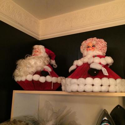 Folk art Mr. and Mrs. Claus figures..