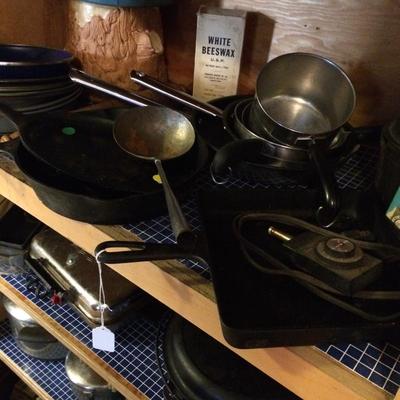 Cast-iron cookware and miscellaneous pots.