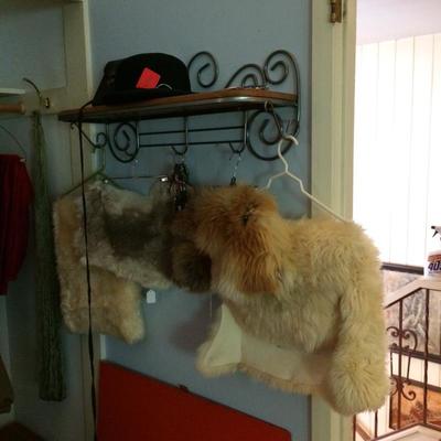 Vintage derby hat and sheepskin rugs.