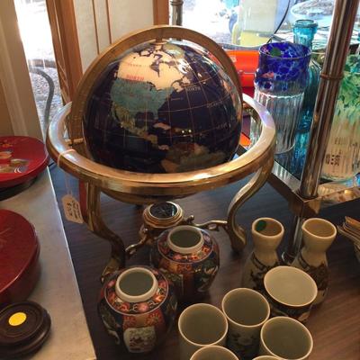 Globe of world made with inlaid semi precious stone.