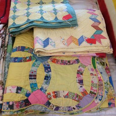 Close up of quilts.