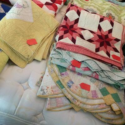 Close up of quilts.