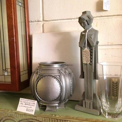 Frank Lloyd Wright reproductions of concrete garden nymph and heavy pewter finished vase.
