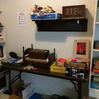 Old Philco radio, dolls, toys and antique doll bed.