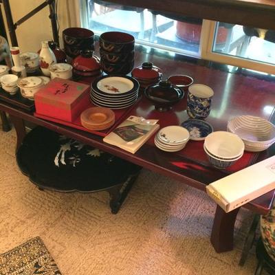 Fold up Japanese lacquer table for tea ceremony with Japanese bowls and tea sets..