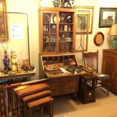 Set of Rattan nesting tables and slant-front secretary desk made of oak.