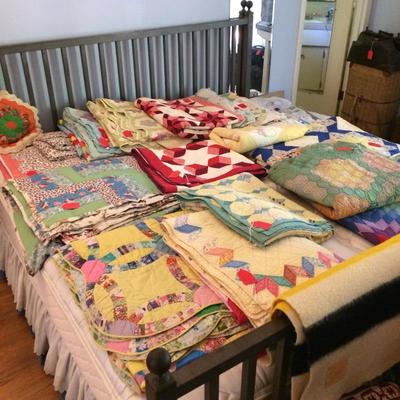 Over one dozen well-kept antique and vintage quilts.