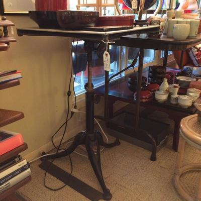 Utilitarian table with cast-iron base and aluminum table top.