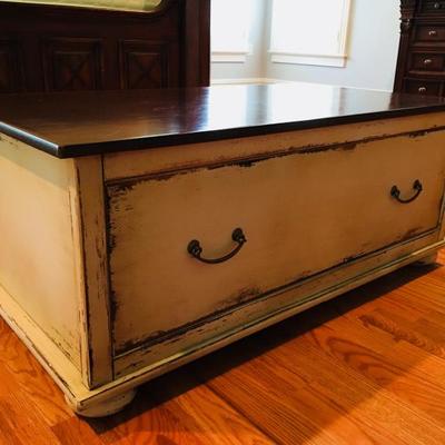 Antiqued beige/ivory Chest/ Trunk. Dark cherry wood finish on top. Slightly used