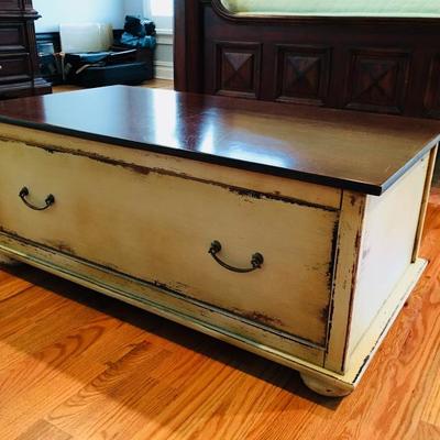Antiqued beige/ivory Chest/ Trunk. Dark cherry wood finish on top. Slightly used