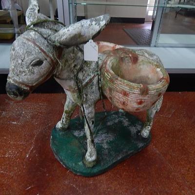 Concrete donkey with baskets
