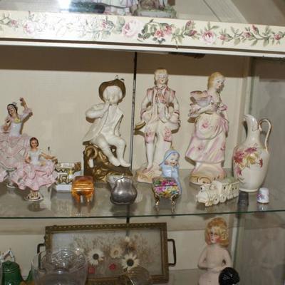 View of Porcelain Figures inside Display Cabinet 