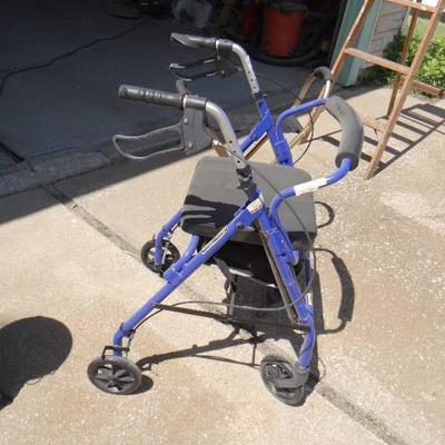 Foldable seat and walker with seat.