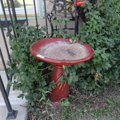 Red bird bath.