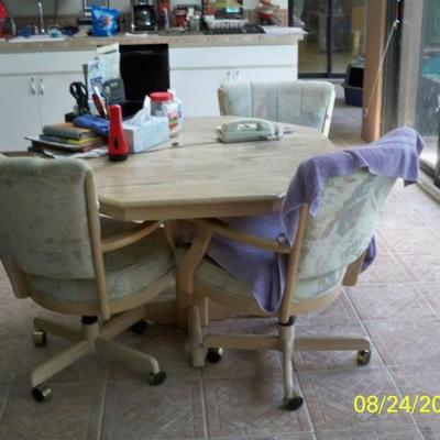 Dinette table with 4 chairs on casters