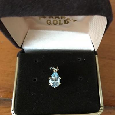14 Gold pendant, matching pierced earrings available.