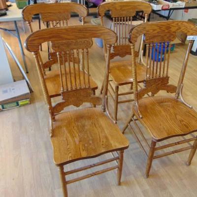 4 Nice wood press back dining chairs.