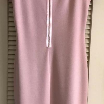 This gorgeous St John Knit dress is never worn and has original tags. Simply classic and elegant.
