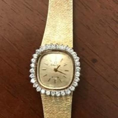 14k Gold Omega De Ville Vintage Halo Watch with 30 diamonds bezel and smooth gold mesh band. Measures 6â€ inches long
