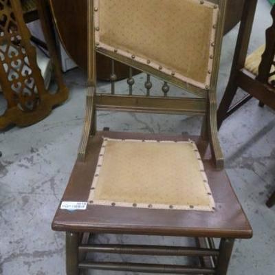 Rocking chair with padding on back part.
