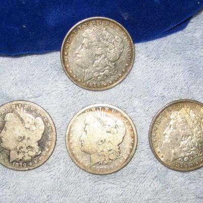 60 Silver Dollars arrive at the home on sale day, these dates 1878 & 1879