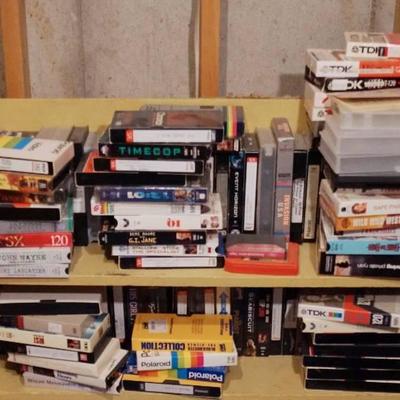 Lot of VHS Movies (shelf not included) see pics fo .