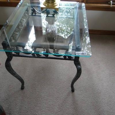 Glass top side table with metal base.