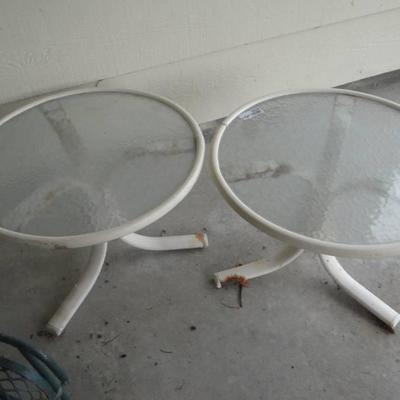 2 Outdoor small tables metal base glass top.