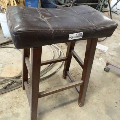Leather padded bar stool.