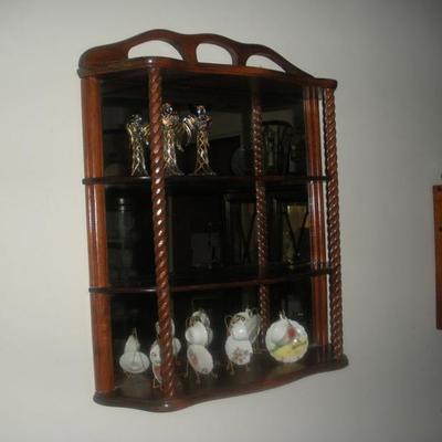 small mirrored back wall shelf
